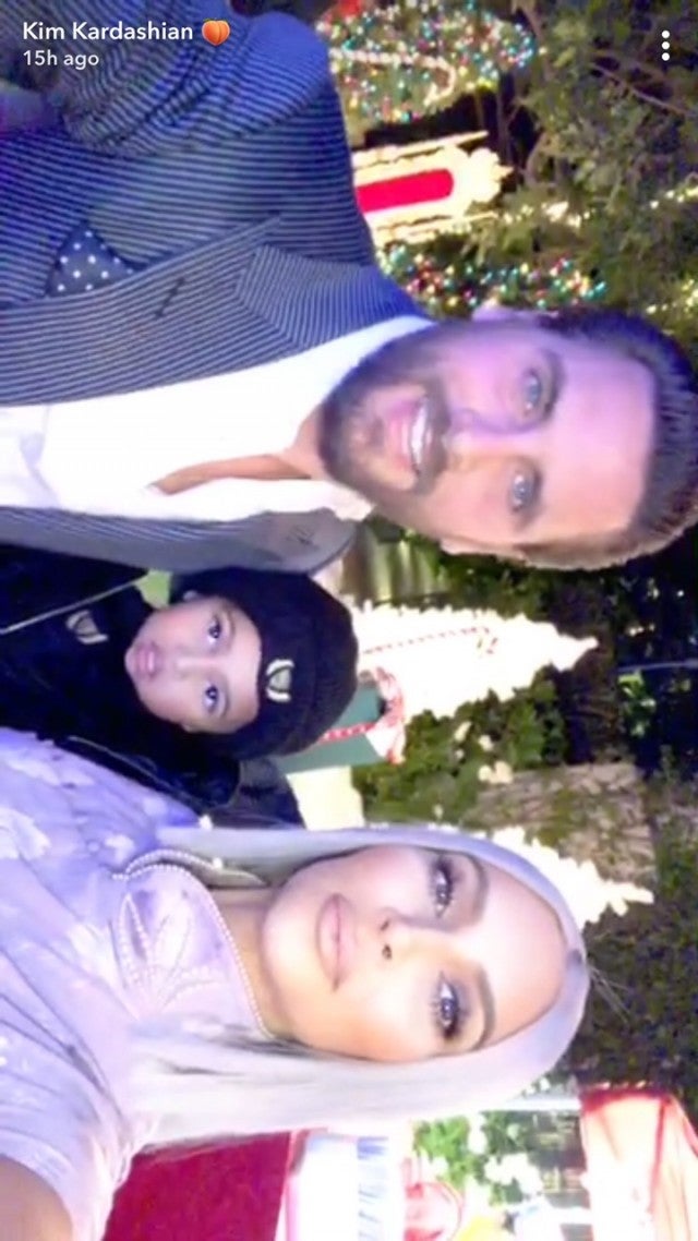 Scott Disick, Saint and Kim Kardahshian on xmas eve