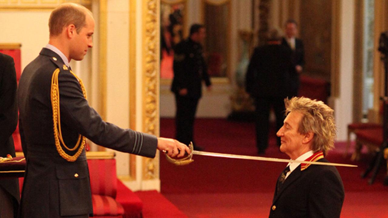 Prince William Knights Rod Stewart at Buckingham Palace -- See the