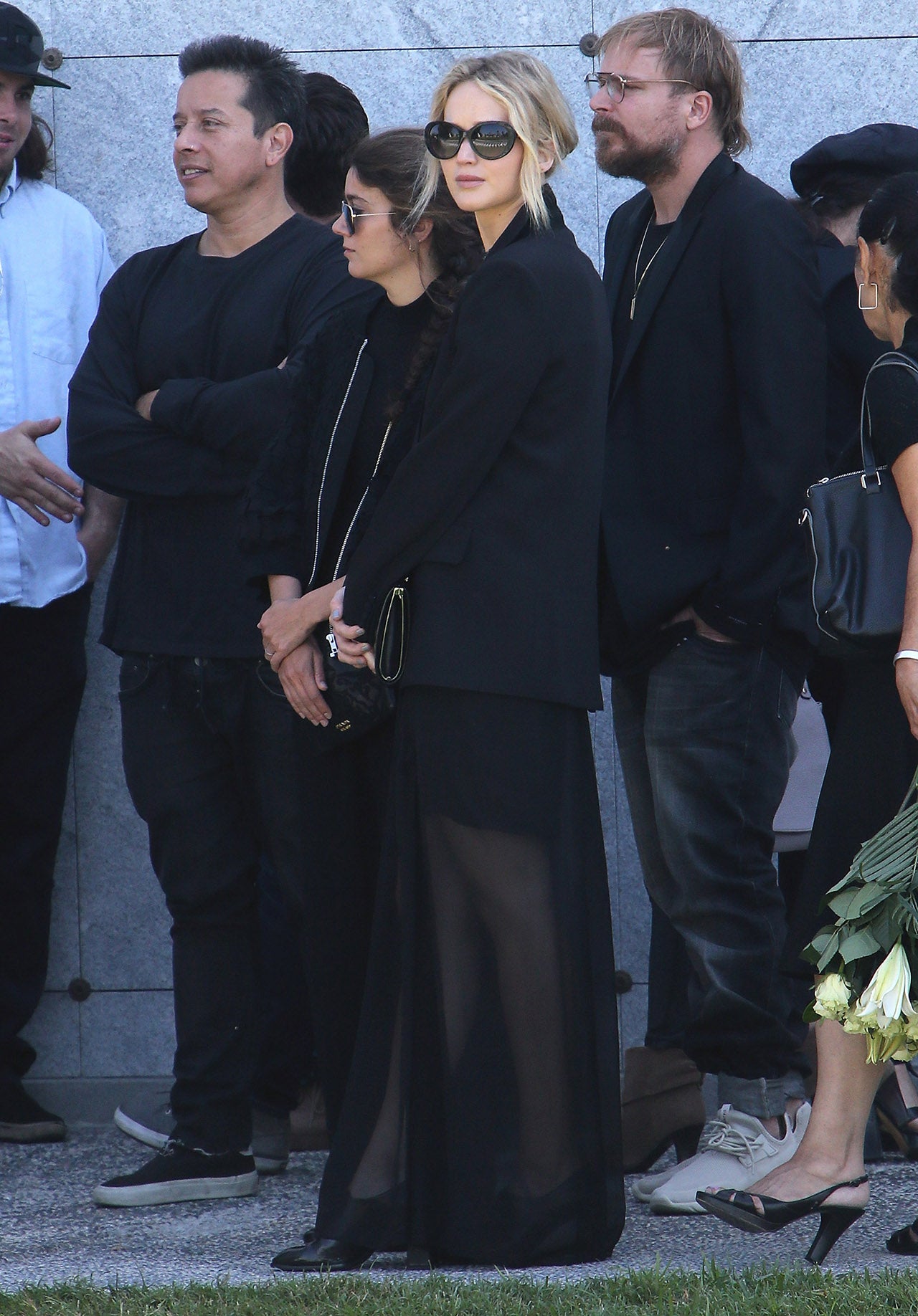 Jennifer Lawrence attends Anton Yelchin's service