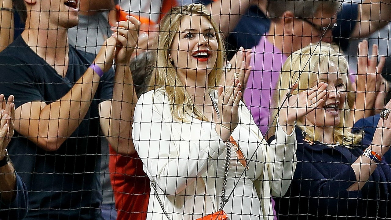 Justin Verlander waves to Kate Upton and baby