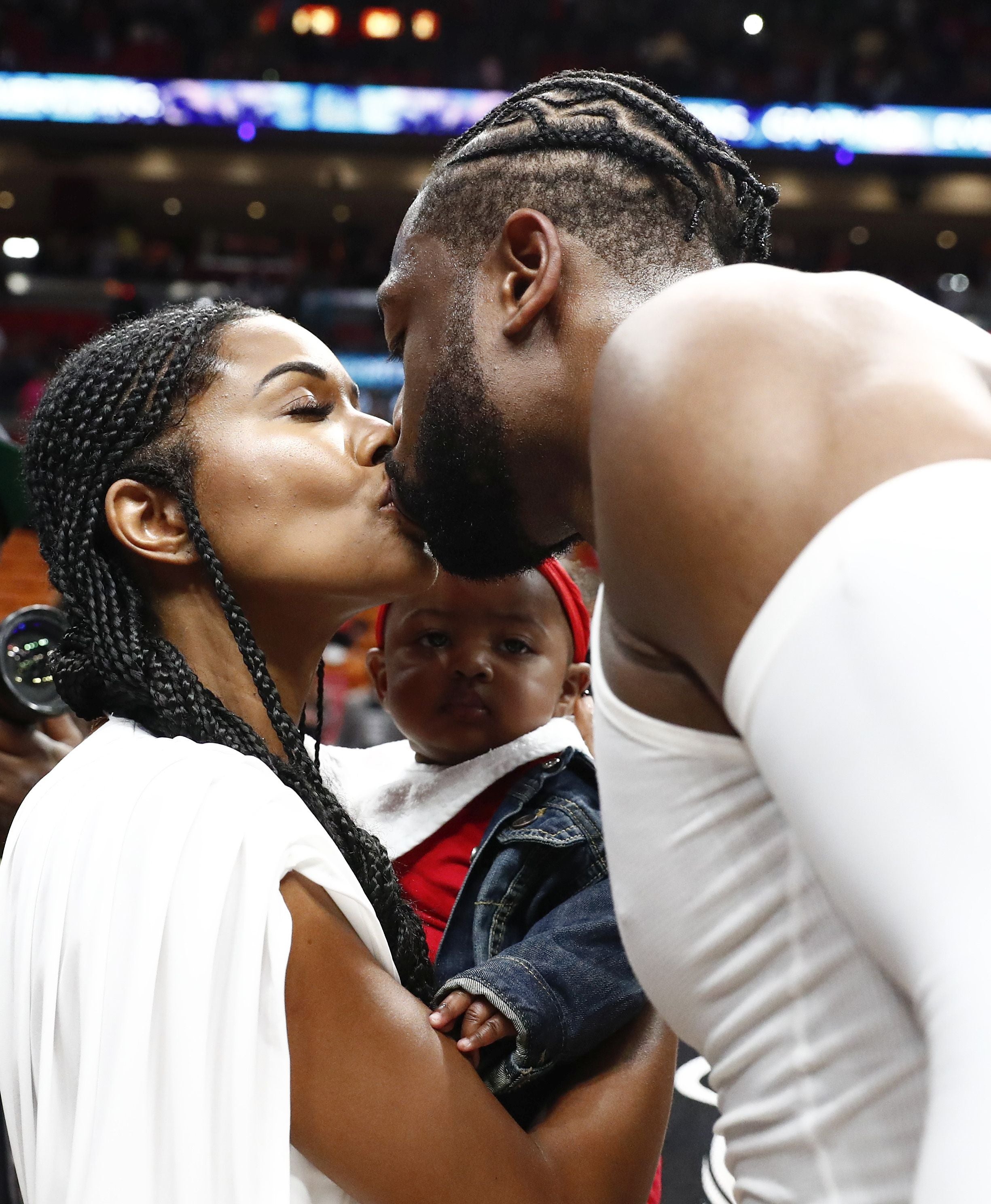 Dwyane Wade, Gabrielle Union, and Kaavia at Miami Heat Game