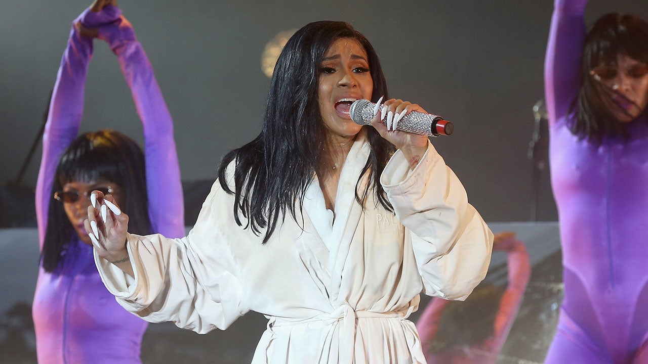Cardi B Performs in a Bathrobe After Her Costume Rips Onstage |  Entertainment Tonight