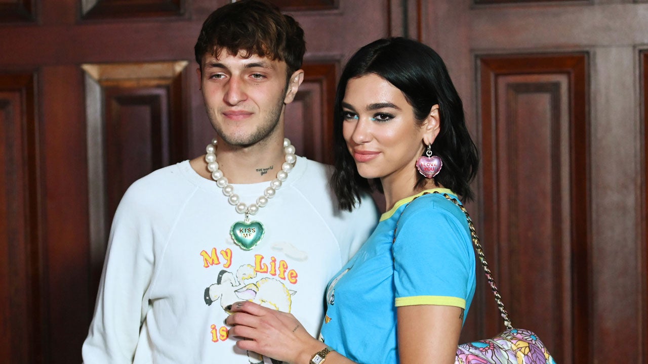 Dua Lipa shows off her enviable figure in a red top after enjoying a lunch  with beau Anwar Hadid