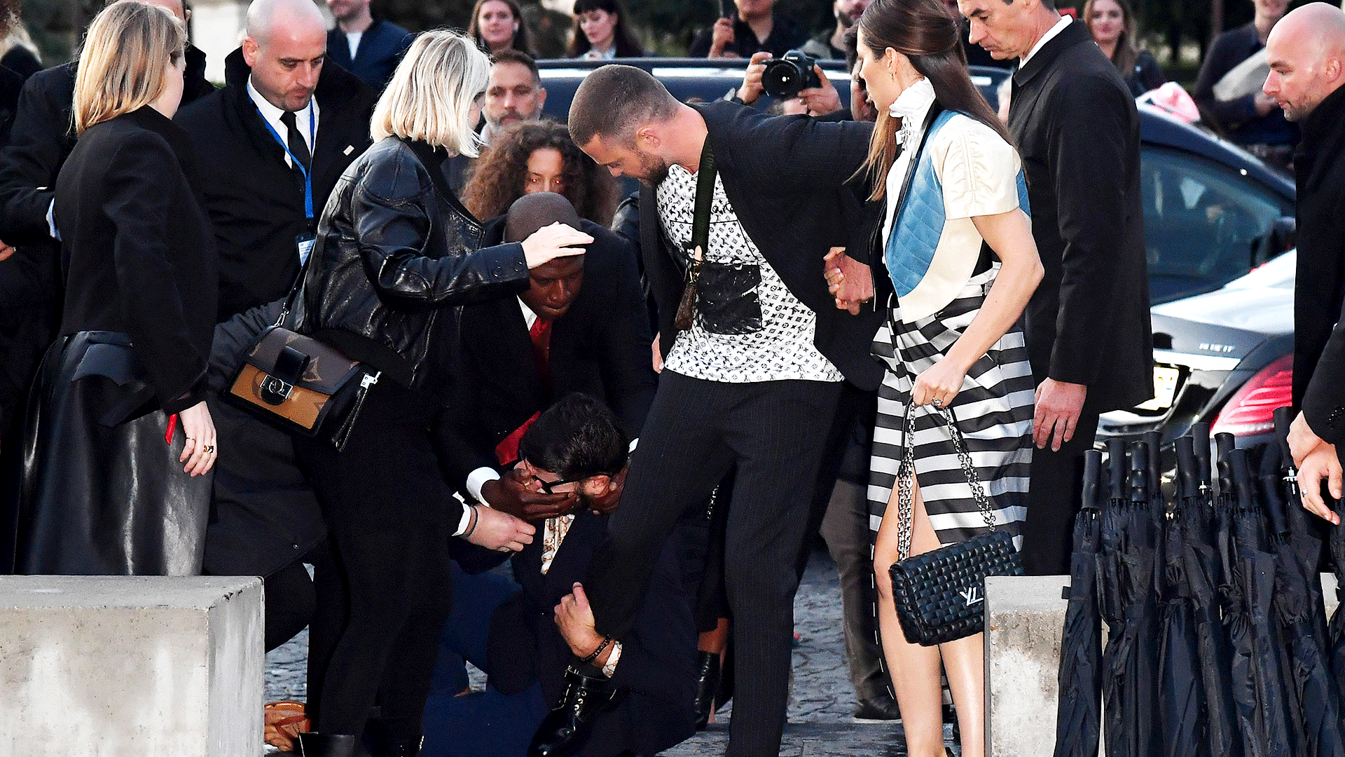 Justin Timberlake Is Nearly Tackled by Fan as He Enters Paris