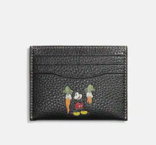 Some Call For Coach x Disney Boycott For Merchandise Evoking