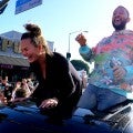 Chrissy & John Celebrate Joe Biden Win Driving Through West Hollywood