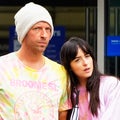 Dakota Johnson Leans Lovingly on Boyfriend Chris Martin in Rare Outing