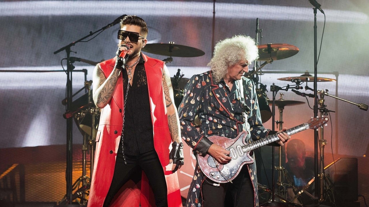 Adam Lambert and Brian May perform on stage at the O2 Arena in London, England, on July 1.