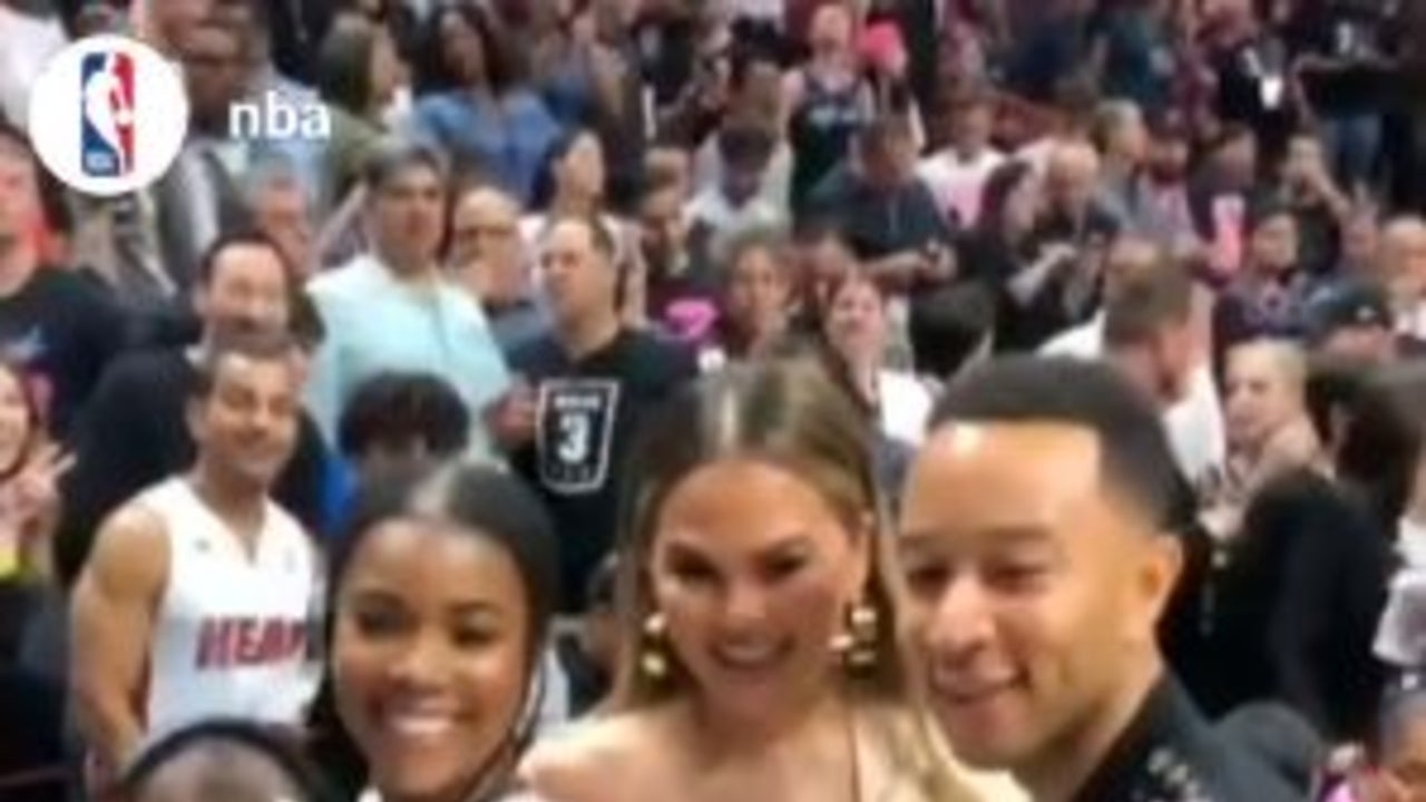 Dwyane Wade, Gabrielle Union, and Kaavia at Miami Heat Game