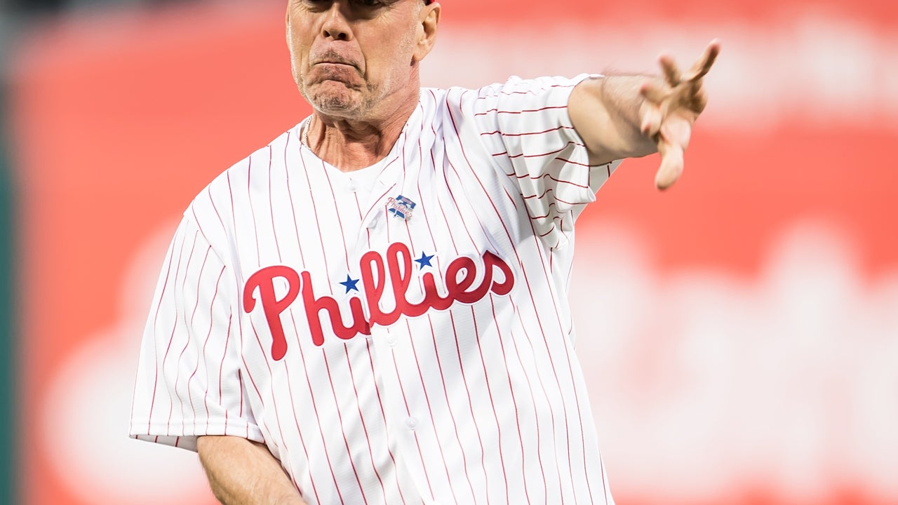 Actor Bruce Willis throws out first pitch, hits batting practice