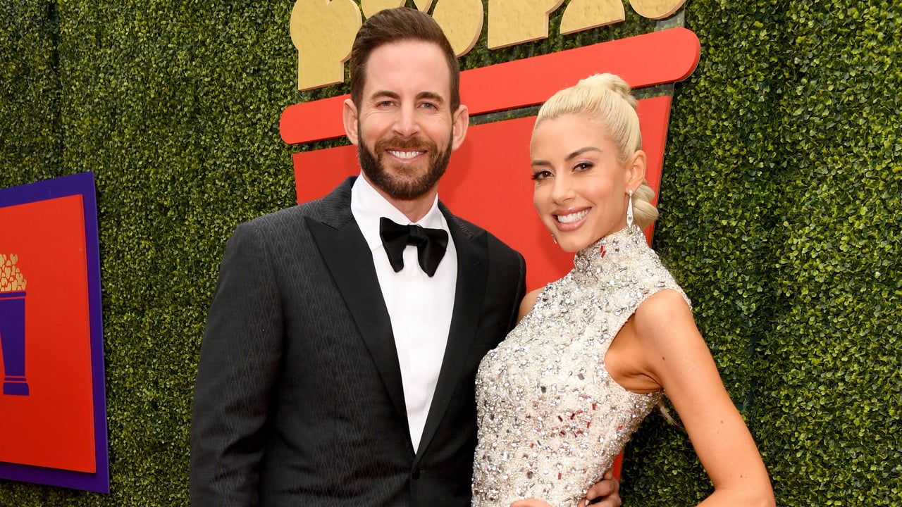 Tarek El Moussa and Heather Rae Young attend the 2021 MTV Movie & TV Awards: UNSCRIPTED in Los Angeles.