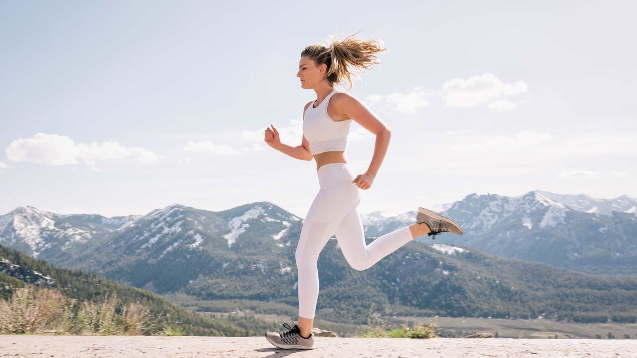 Woman Running on Mountain