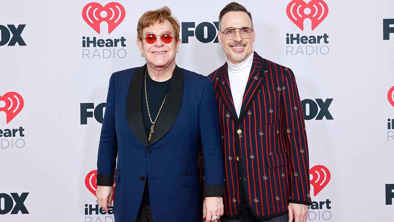 Elton John and David Furnish attend the 2021 iHeartRadio Music Awards at The Dolby Theatre in Los Angeles, California