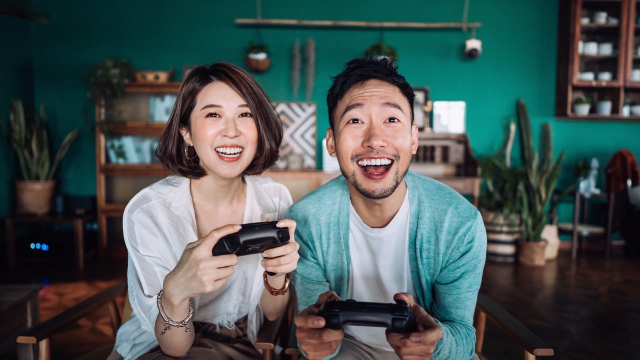 Couple playing video games together