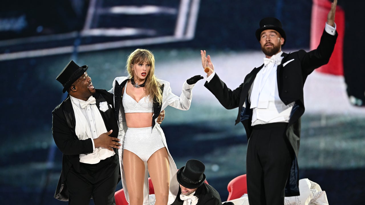 Taylor Swift is joined on stage by Travis Kelce (R), during "Taylor Swift | The Eras Tour" at Wembley Stadium on June 22, 2024 in London, England