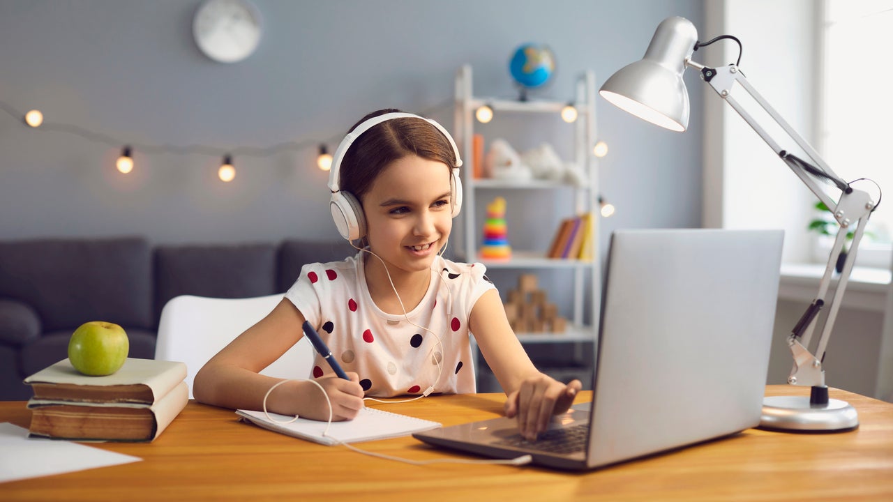 Girl at desk with laptop