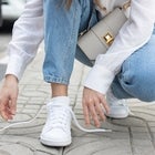 woman tying sneaker