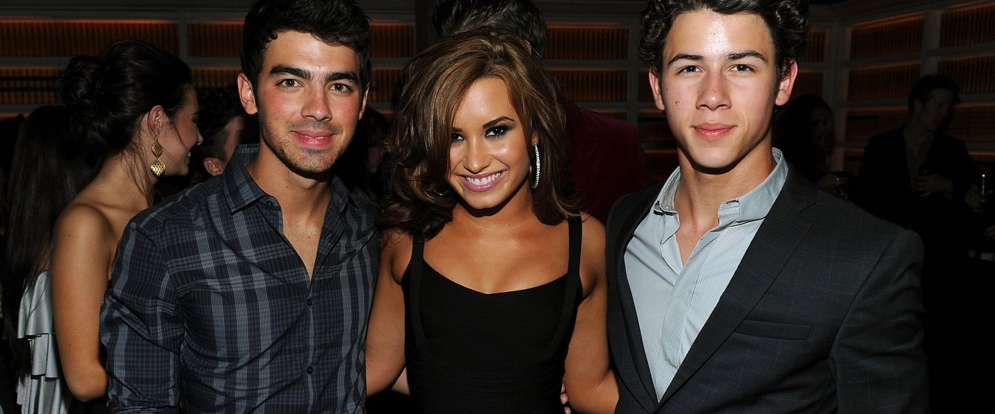 Joe Jonas, Demi Lovato and Nick Jonas in 2010