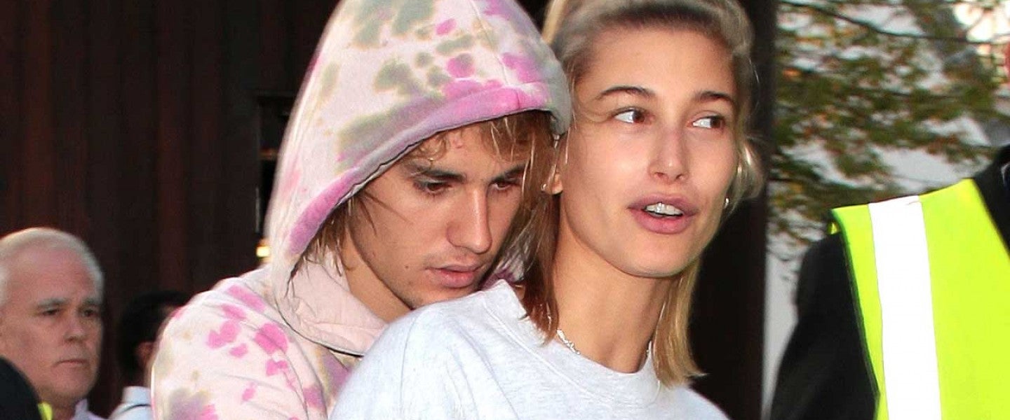 Justin Bieber and Hailey Baldwin share a 'mask kiss' as they step