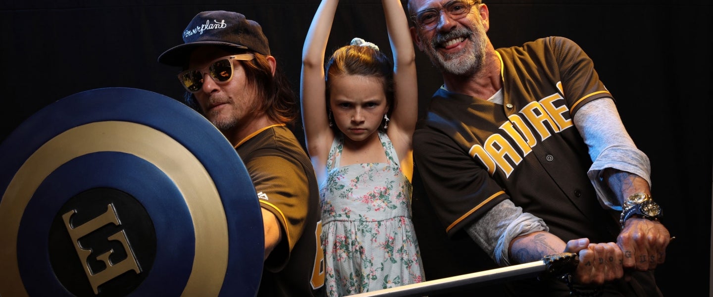 Norman Reedus, Cailey Fleming and Jeffrey Dean Morgan at et booth at comic-con
