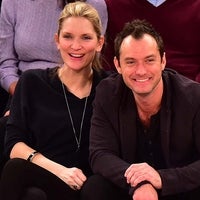 Phillipa Coan and Jude Law attend the Orlando Magic vs New York Knicks game at Madison Square Garden on February 26, 2016 in New York City. 