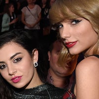 Charli XCX and Taylor Swift pose backstage at iHeartRadio Jingle Ball 2014