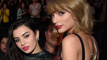 Charli XCX and Taylor Swift pose backstage at iHeartRadio Jingle Ball 2014