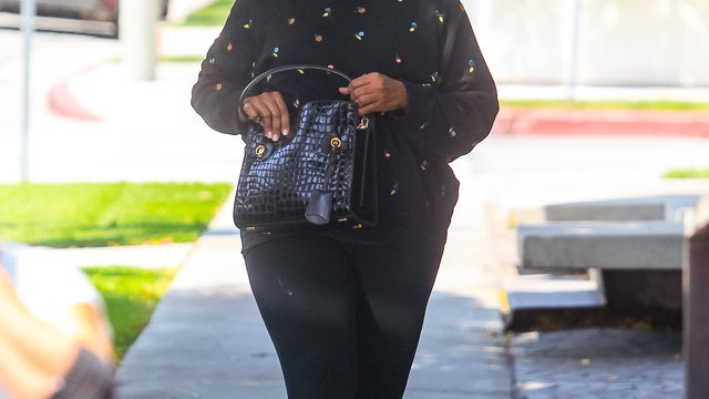 A black leather Louis Vuitton 'Alma' tote bag is seen during the News  Photo - Getty Images