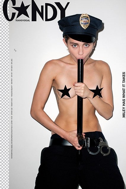 NSFW Miley Cyrus Is Naked and Sucking on a Police Baton in