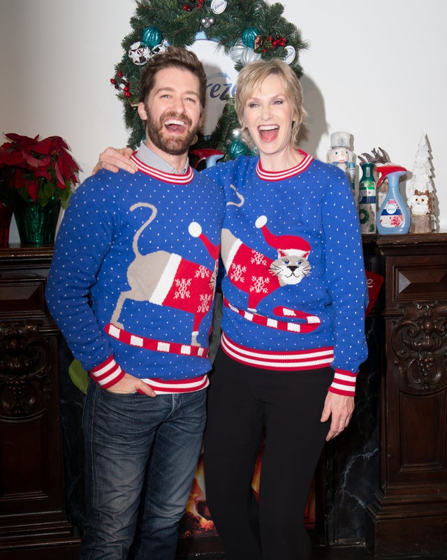 Matthew Morrison and Jane Lynch in ugly Xmas sweaters