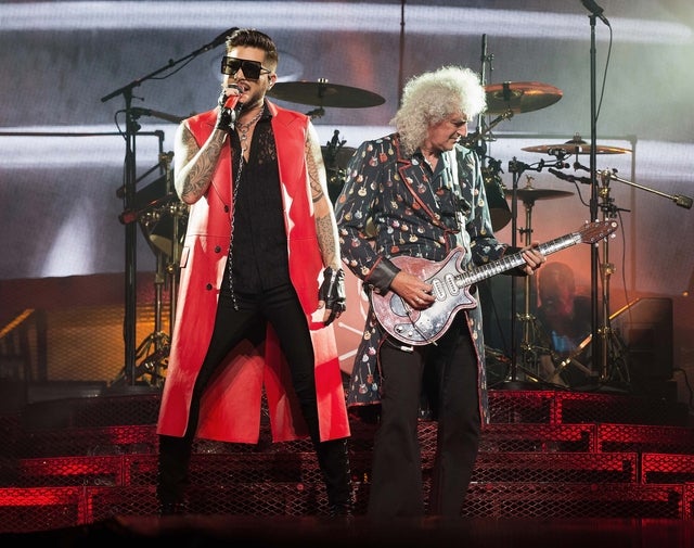 Adam Lambert and Brian May perform on stage at the O2 Arena in London, England, on July 1.