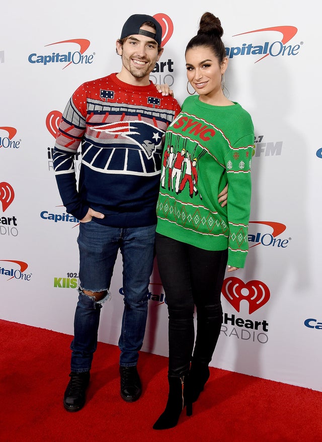 Jared Haibon and Ashley Iaconetti in ugly christmas sweaters