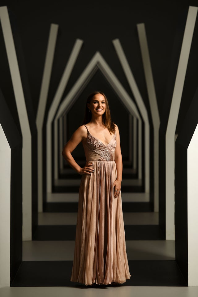 Natalie Portman poses in the Escher x Nendo | Between Two Worlds Exhibition