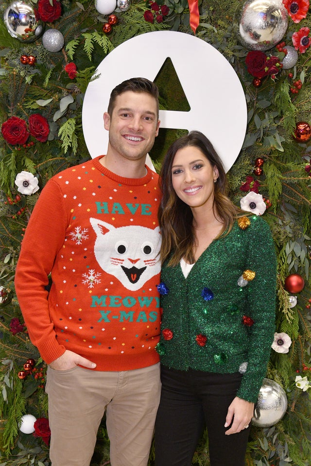 Garrett Yrigoyen and Becca Kufrin in ugly christmas sweaters