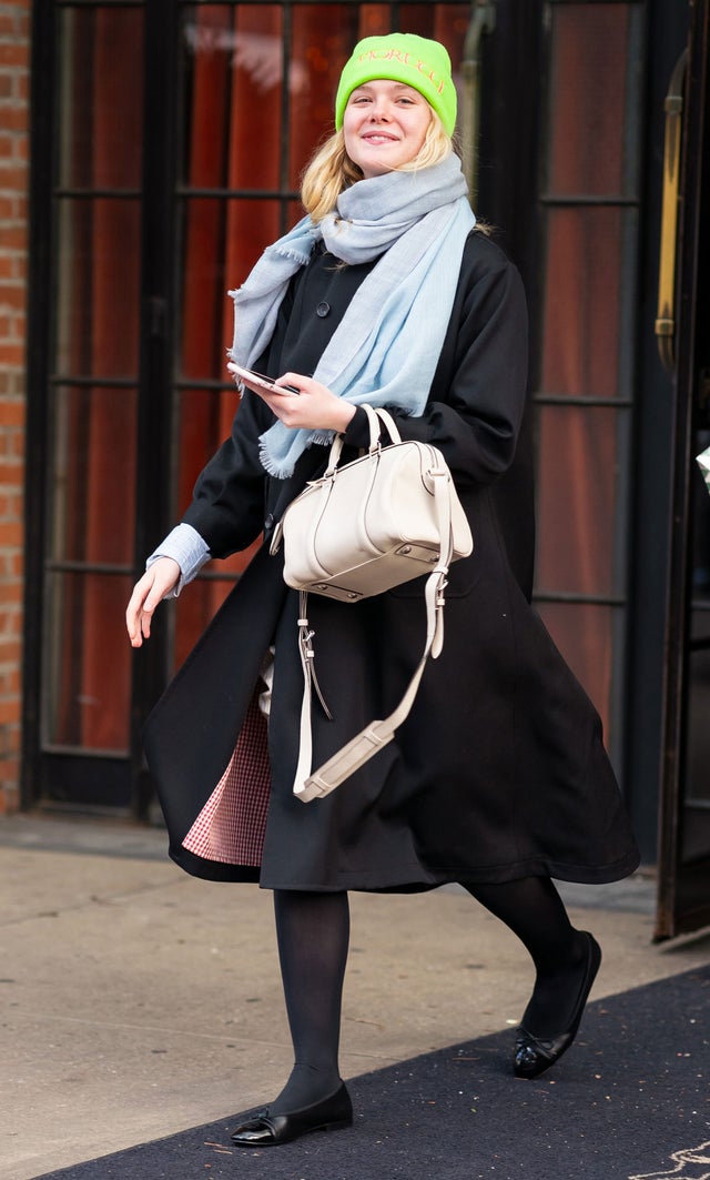 Elle Fanning in NYC in neon hat