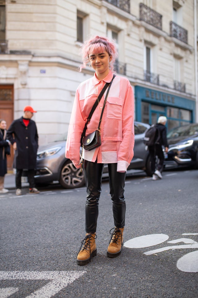 Maisie Williams with pink hair and in pink jacket