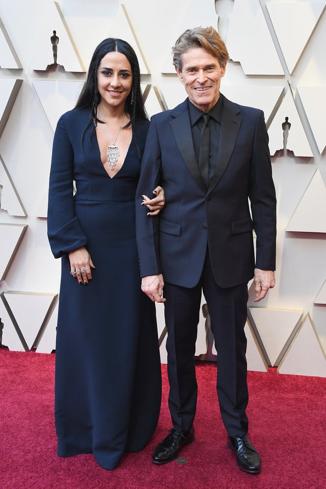 Willem Dafoe and wife at oscars 2019