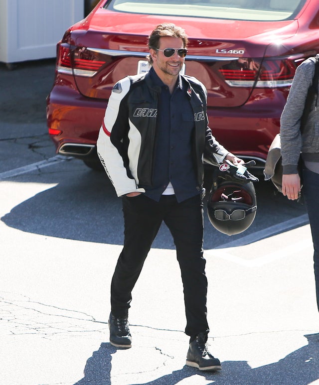 Bradley Cooper gets off motorcycle