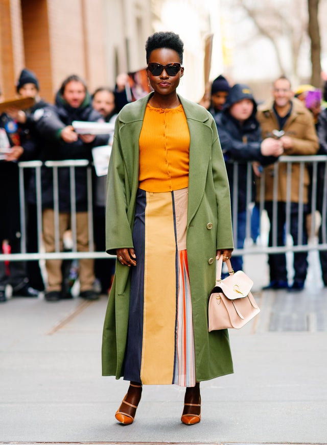 Lupita Nyong'o in NYC in yellow and green outfit