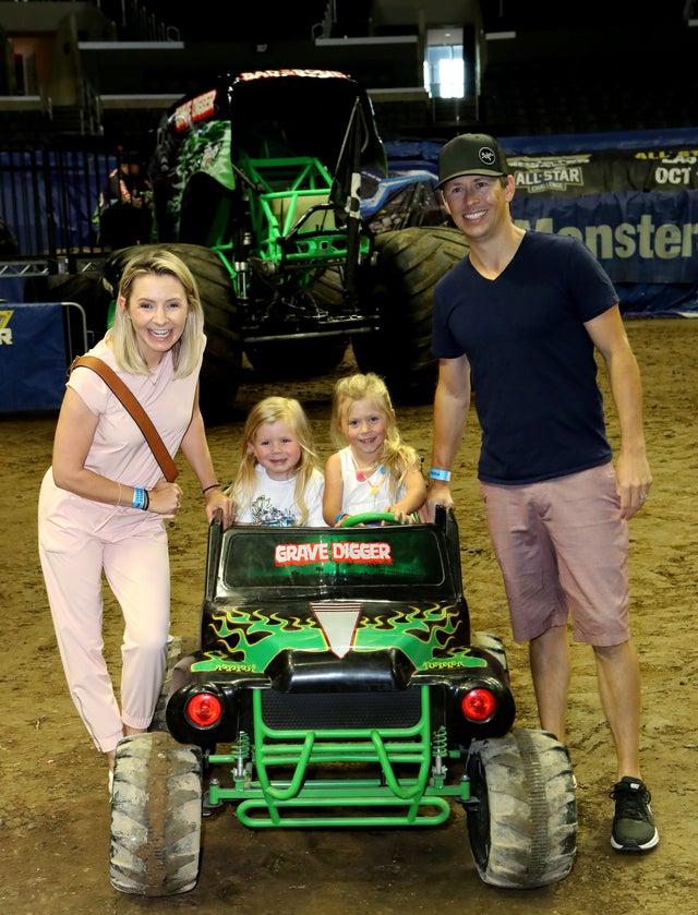 Beverley Mitchell and kids at monster jam
