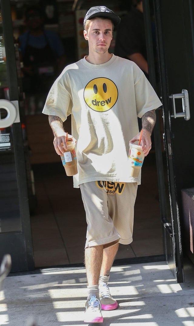 Justin Bieber with two drinks