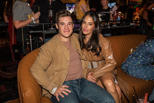 adam devine and chloe bridges at lakers preseason game