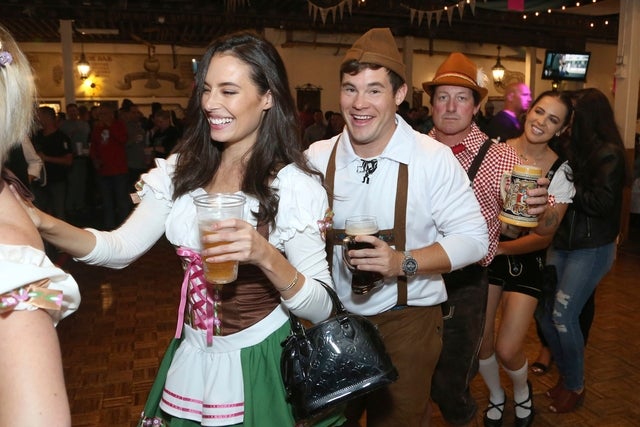 Chloe Bridges and Adam DeVine at oktoberfest