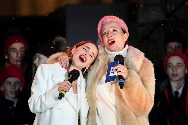 Emilia Clarke and Emma Thompson light xmas tree in london