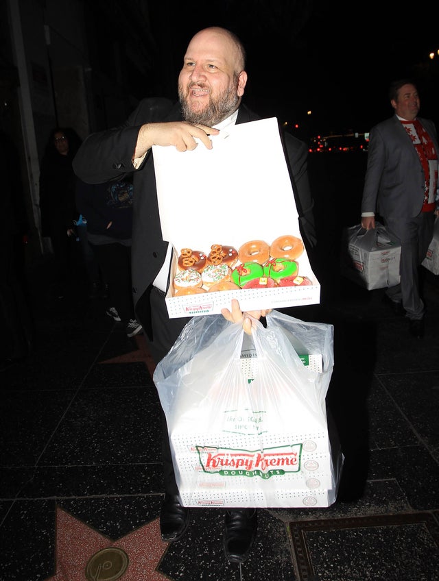 Stephen Kramer Glickman with krispy kreme