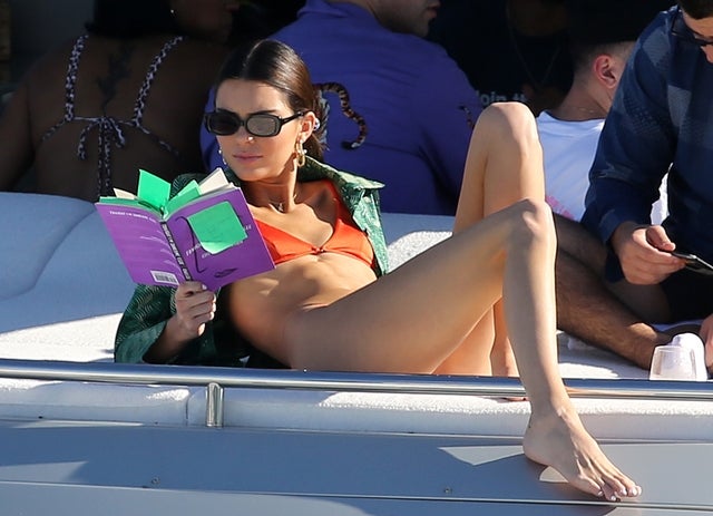 kendall jenner reads a book on yacht in miami
