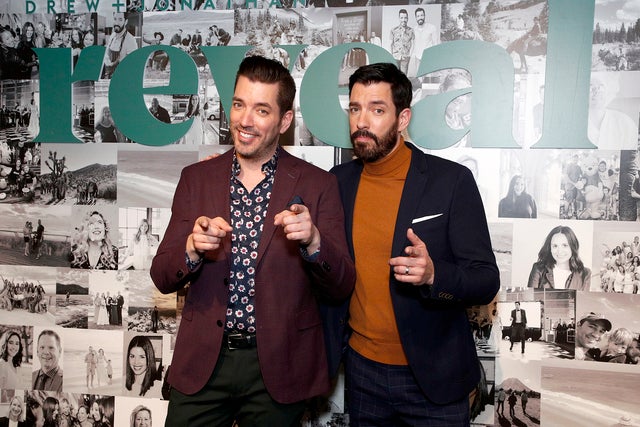 Jonathan Scott and Drew Scott celebrate the premier Issue of reveal