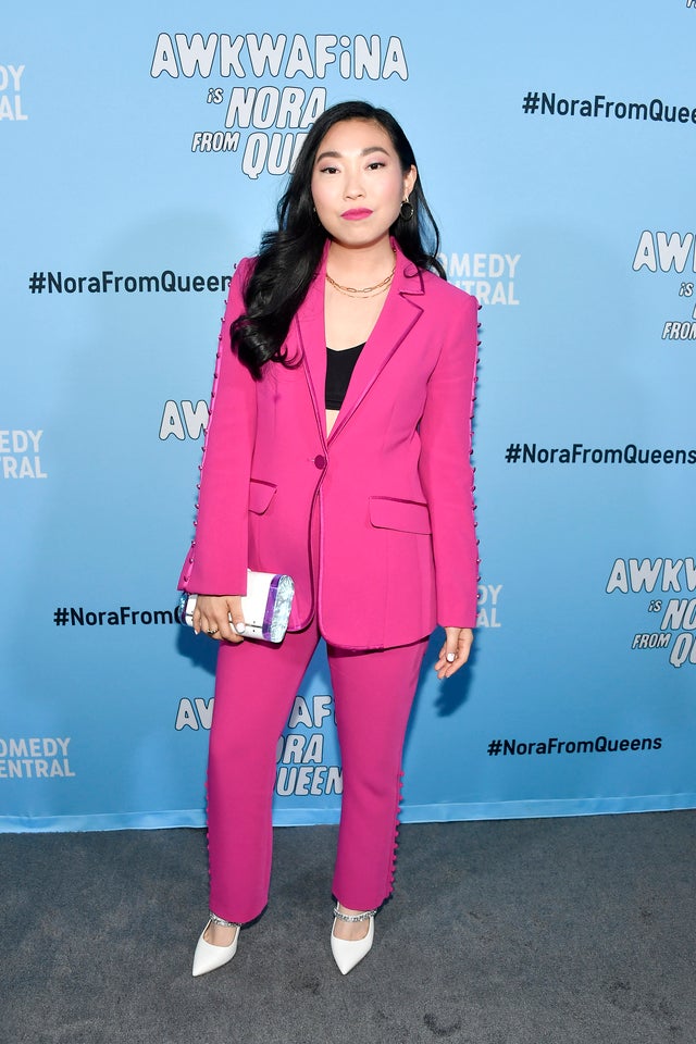 Awkwafina in neon pink suit