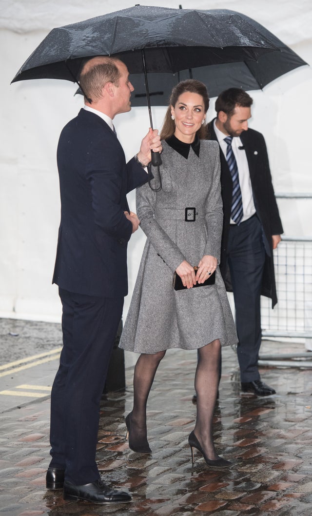 Prince William and Kate Middleton in rain in london