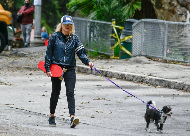 malin akerman with skateboard and her dog